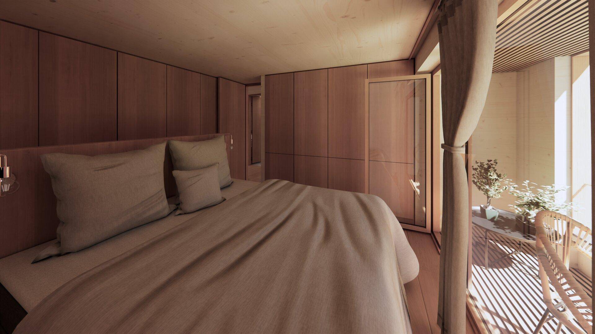 Schlafzimmer mit integrierten Holzschränken, großem Bett und Zugang zum Balkon.