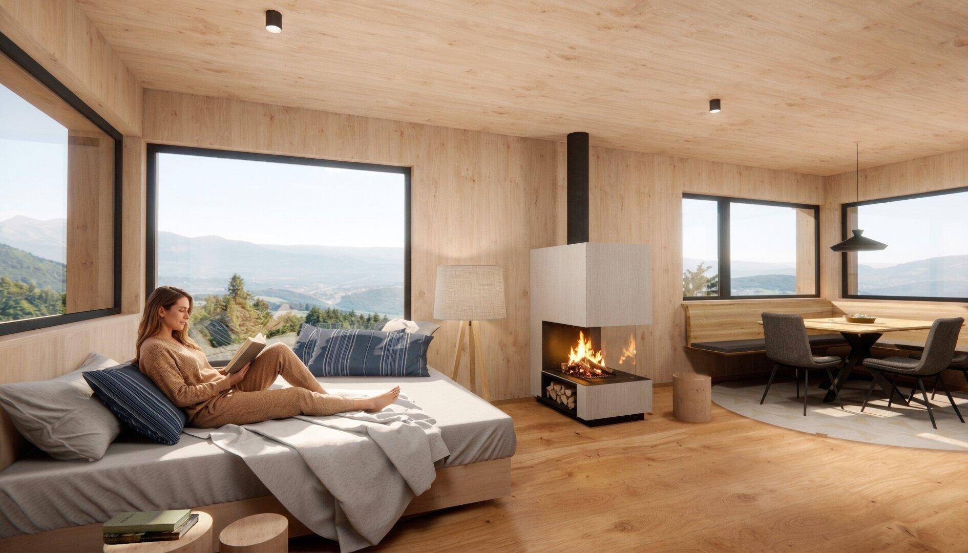 Heller Wohn- und Essbereich mit Holzwänden, Kamin und großen Fenstern mit Bergblick.