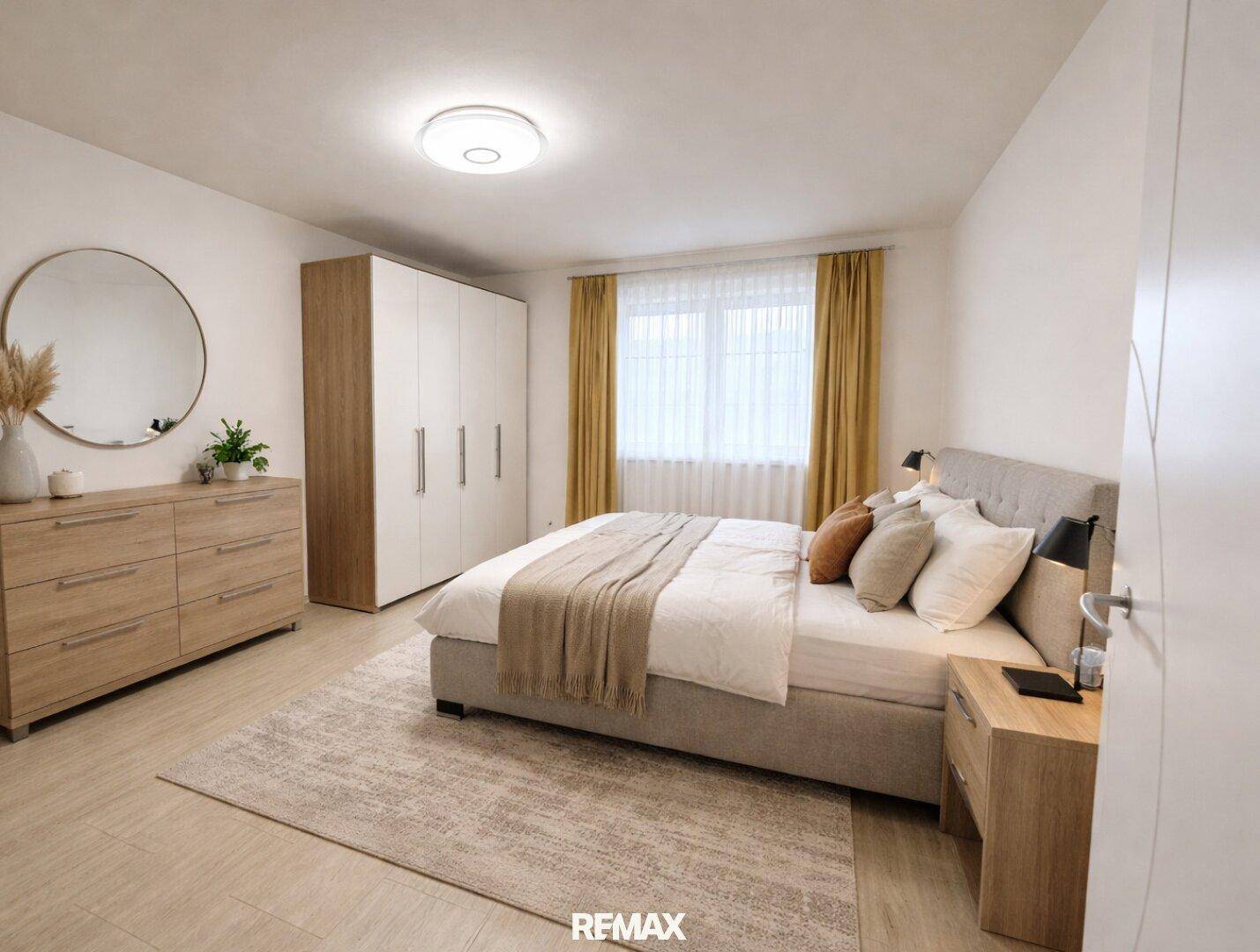 Gemütliches Schlafzimmer mit Doppelbett, Holzkommode und großem Kleiderschrank, hell und einladend.