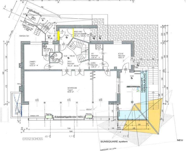 Grundriss des Erdgeschosses mit Wohnraum, Küche und einem modernen Wintergarten.