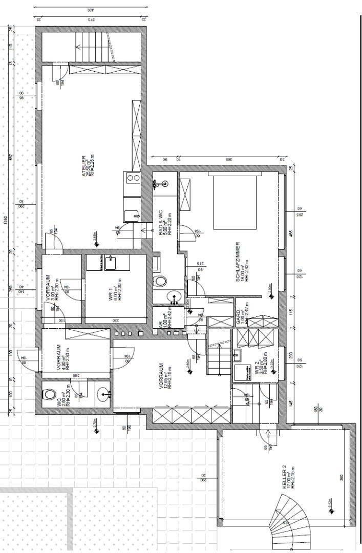 Grundriss des Untergeschosses mit Schlafzimmer, Atelier, zwei Bädern, separatem WC und zwei Kellerräumen.