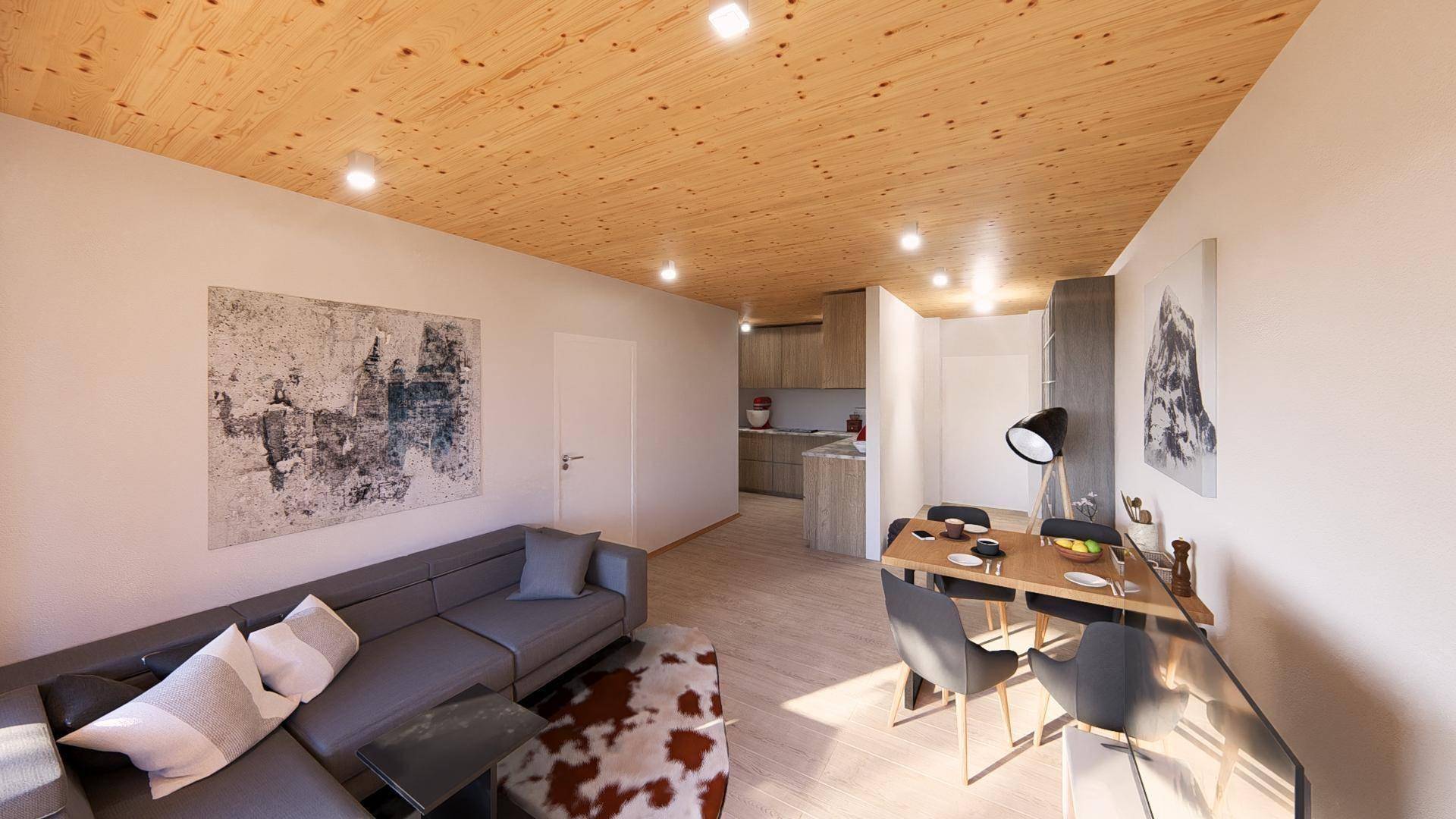 Offener Wohn-Essbereich mit Holzbalkendecke, modernem Sofa und integrierter Küche im Hintergrund.