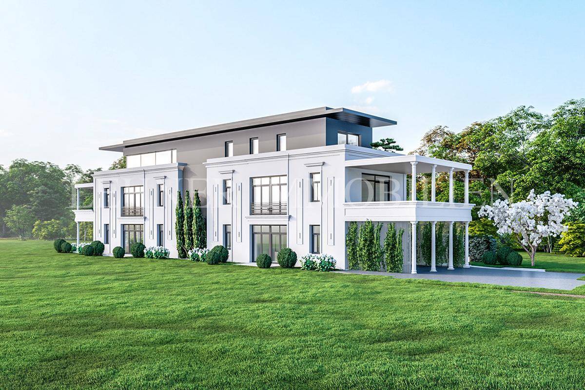 Seitenansicht einer luxuriösen Villa mit weitläufigem Rasen und klassisch-moderner Architektur.