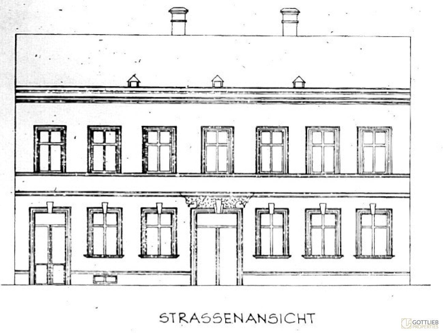 Historische Straßenansicht eines Gebäudes mit mehreren Fenstern und einem Eingangsbereich.