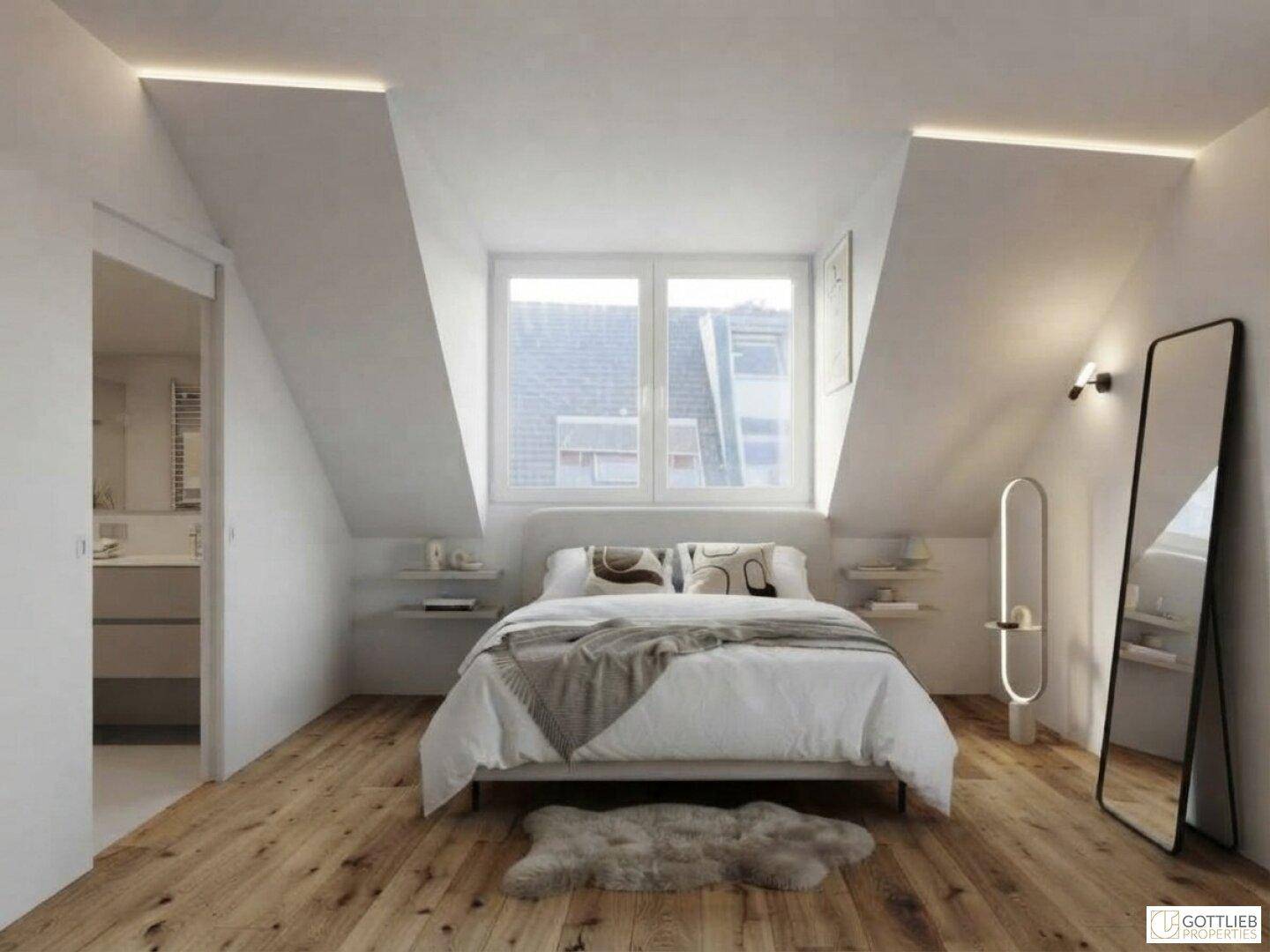 Gemütliches Schlafzimmer im Dachgeschoss mit Bett, Fenster und direktem Zugang zum Badezimmer.