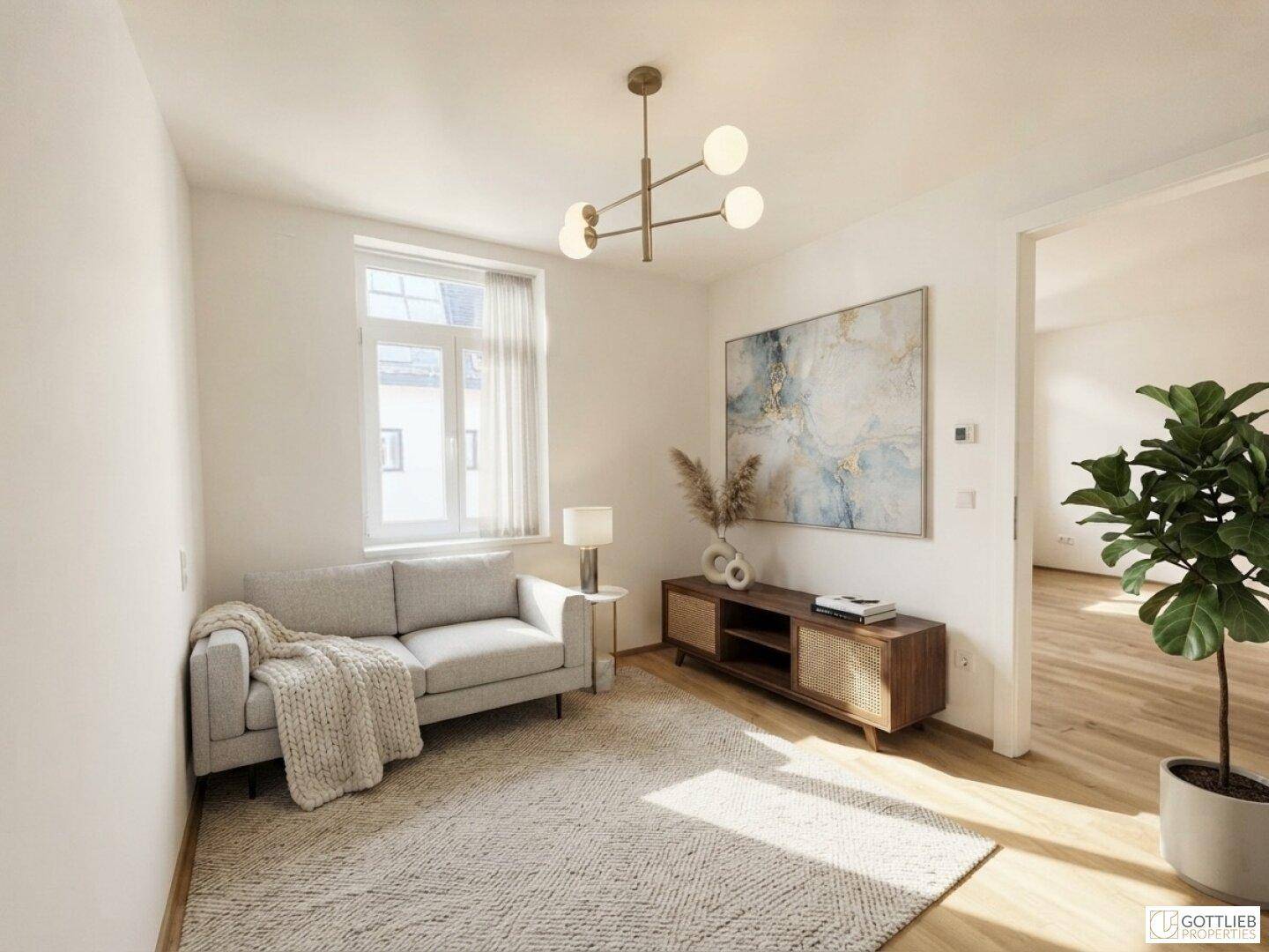 Gemütliches Wohnzimmer mit hellem Sofa, Holzelementen und moderner Kunst an der Wand.