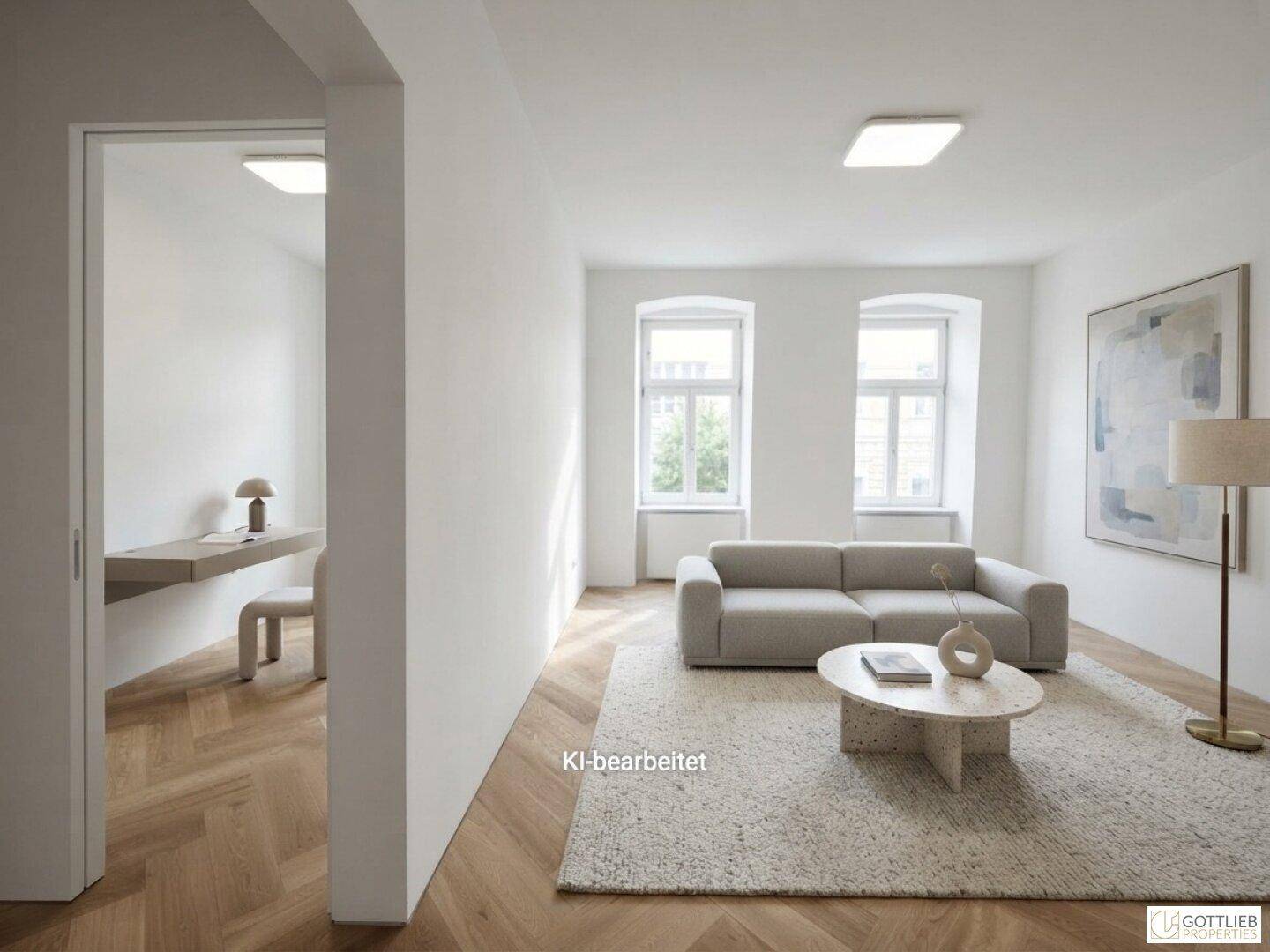 Geräumiges Wohnzimmer mit hellem Sofa, modernem Teppich und Zugang zu einem Arbeitsbereich.