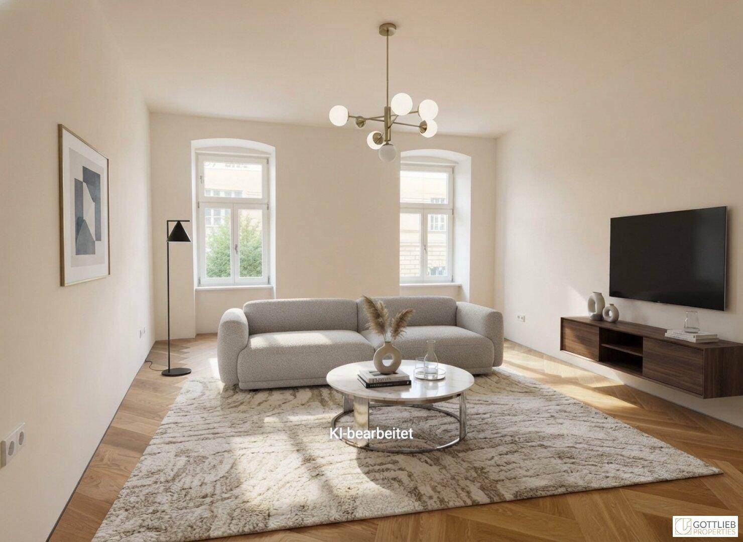 Modernes Wohnzimmer mit bequemem Sofa, Fernseher und stilvollem Fischgrätparkettboden.
