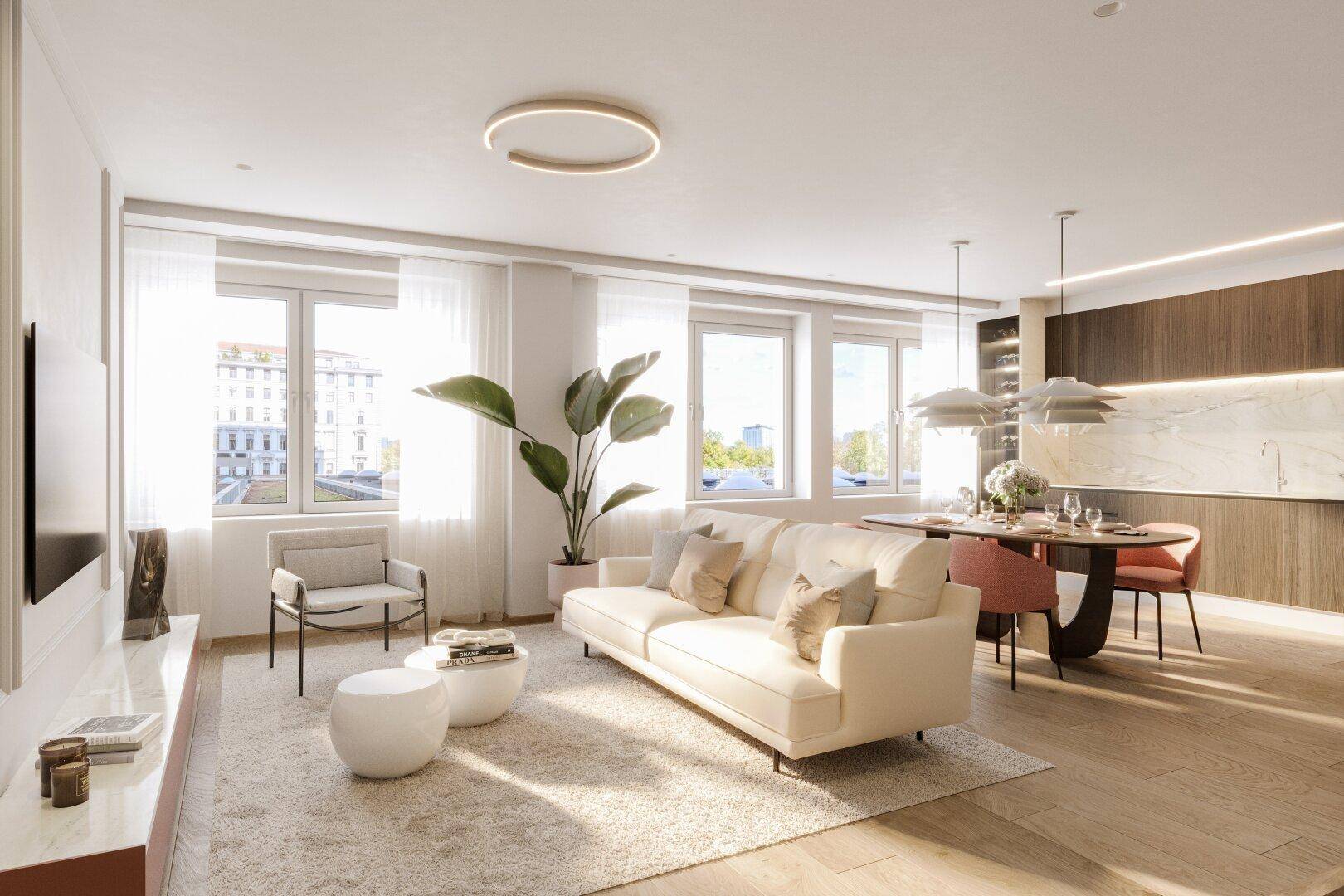 Offener Wohn-Essbereich mit hellem Sofa, modernem Esstisch und großen Fenstern für viel Tageslicht.