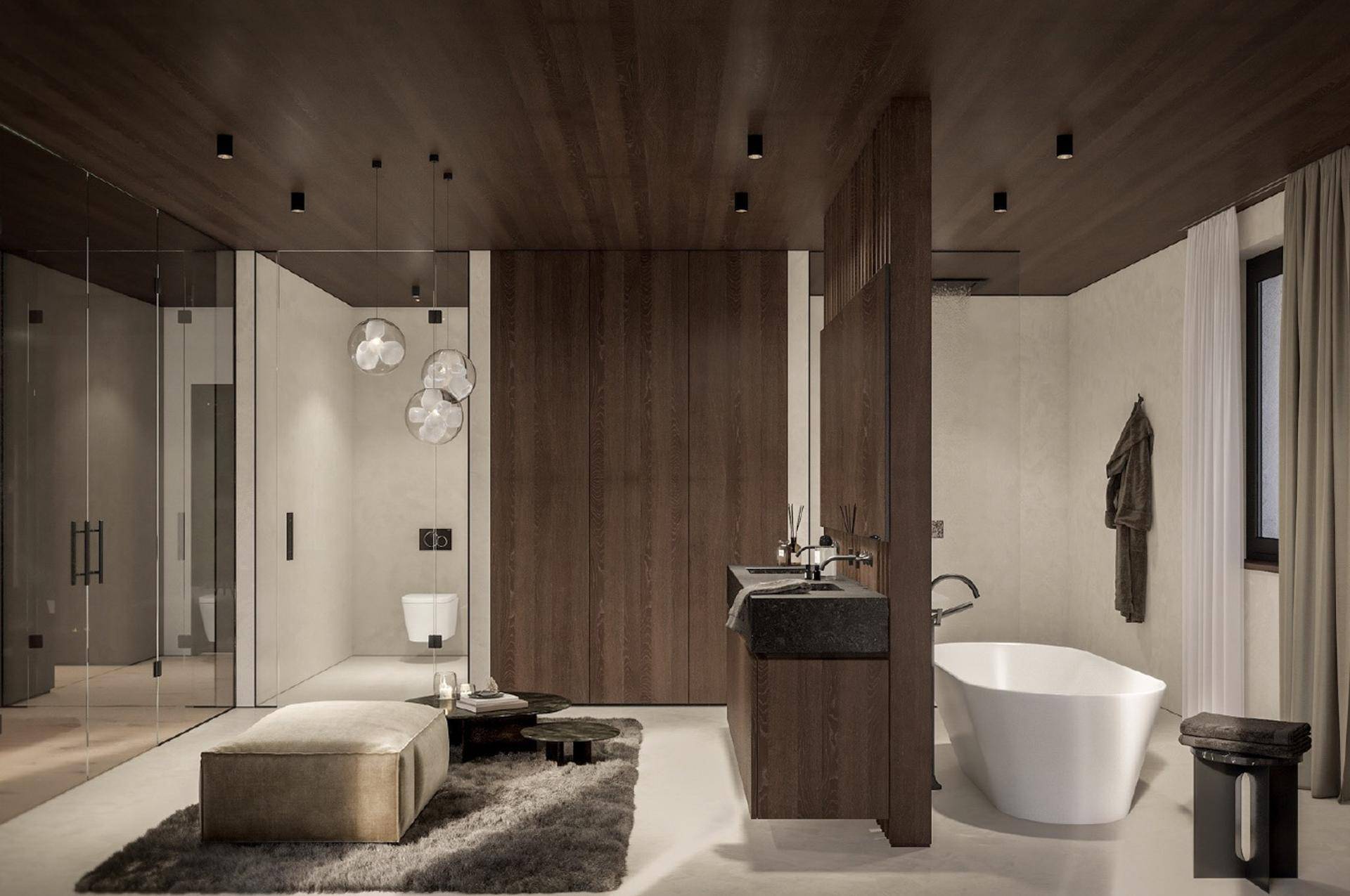 Luxuriöses Badezimmer mit freistehender Badewanne, Doppelwaschbecken und modernen Glasduschen.