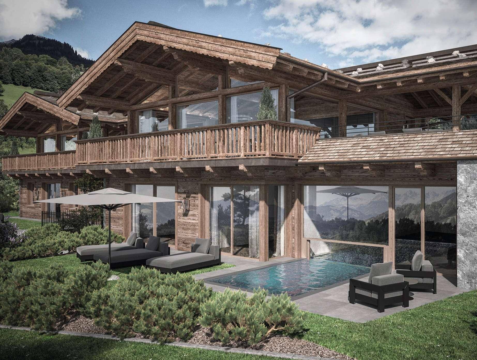 Luxuriöses Chalet mit Außenpool, Liegeflächen und Balkonen, eingebettet in die Berglandschaft.