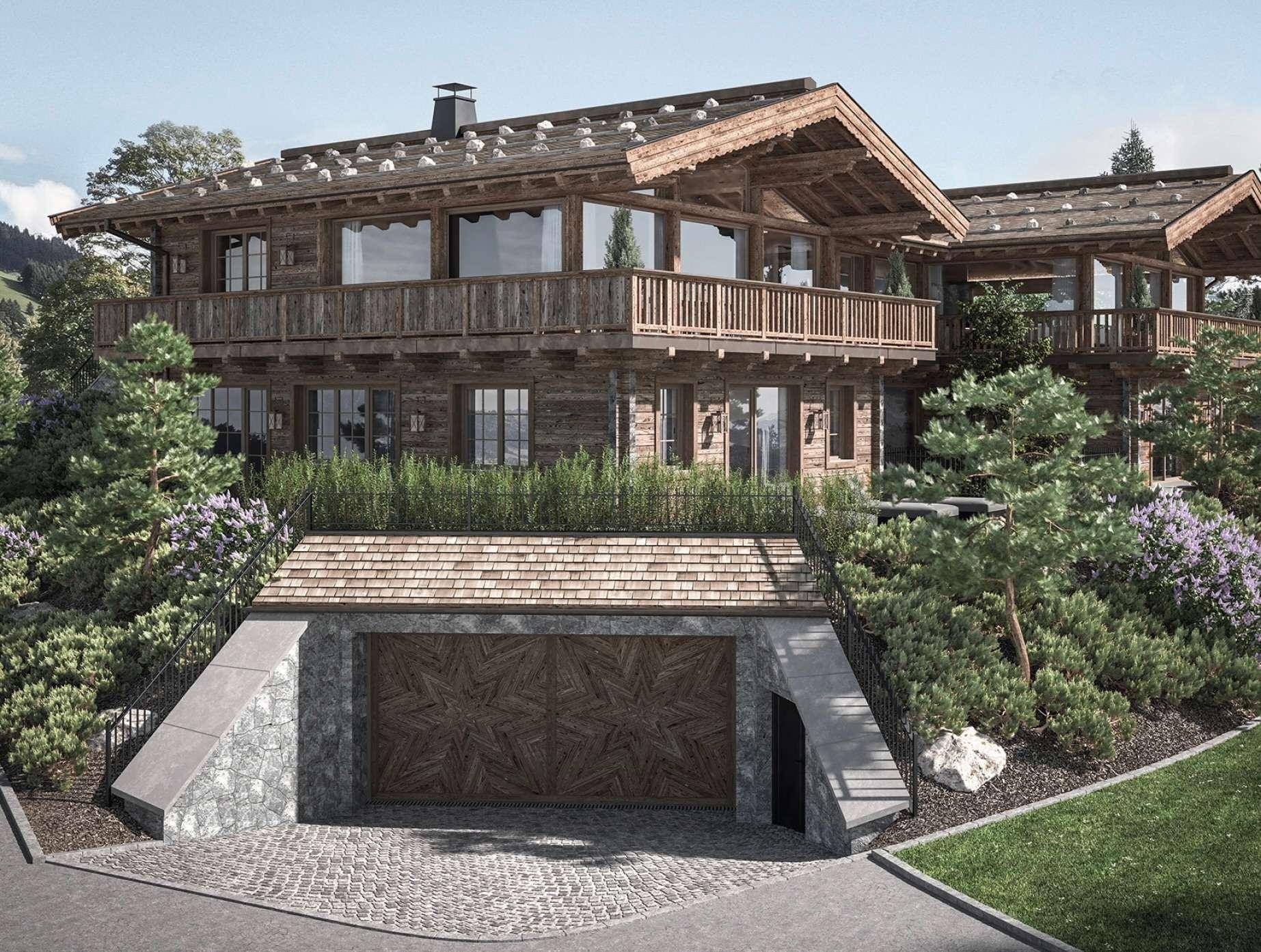 Exklusives Chalet mit integrierter Tiefgarage und traditioneller Holzfassade in alpiner Umgebung.
