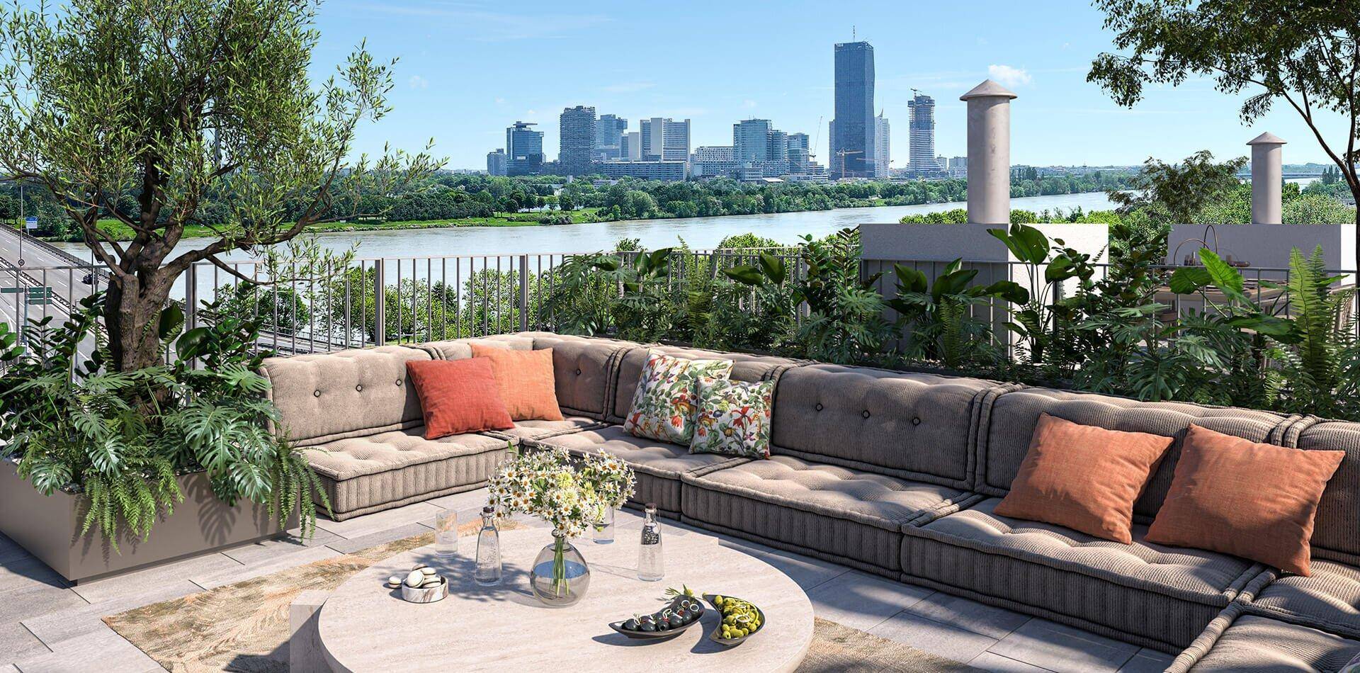 Geräumige Dachterrasse mit bequemen Loungemöbeln, Pflanzen und weitem Blick auf die Stadt und den Fluss.
