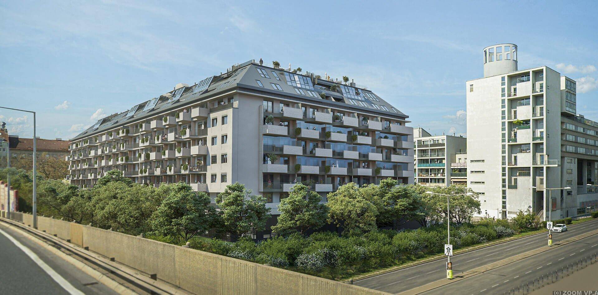 Moderne Wohngebäude mit zahlreichen Balkonen und grüner Umgebung entlang einer Straße.
