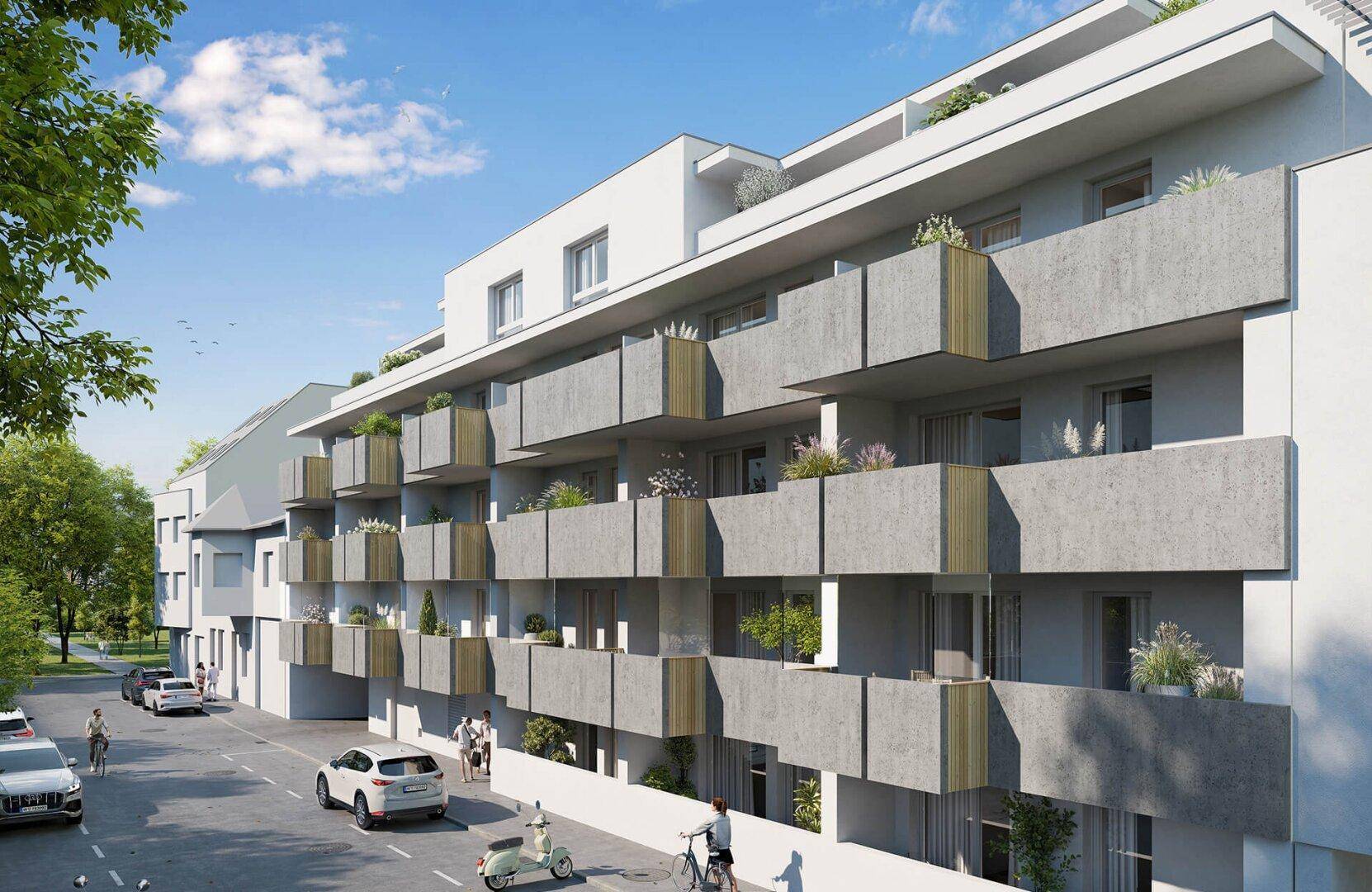 Moderne Wohnanlage mit zahlreichen Balkonen und einer ruhigen Straße davor.