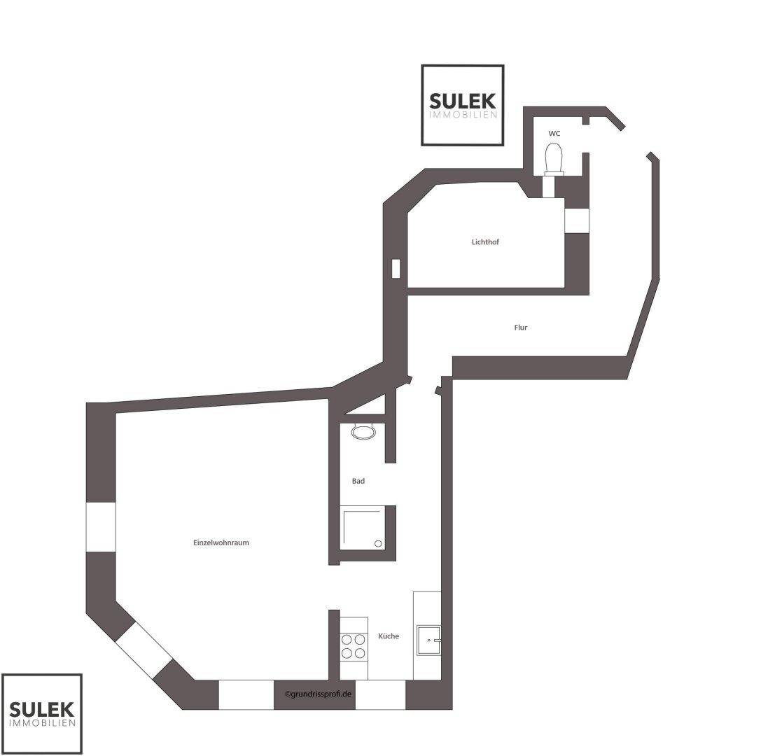Detaillierter Grundriss einer Wohnung mit separatem Wohnraum, Küche, Bad, Gäste-WC und einem Lichthof.
