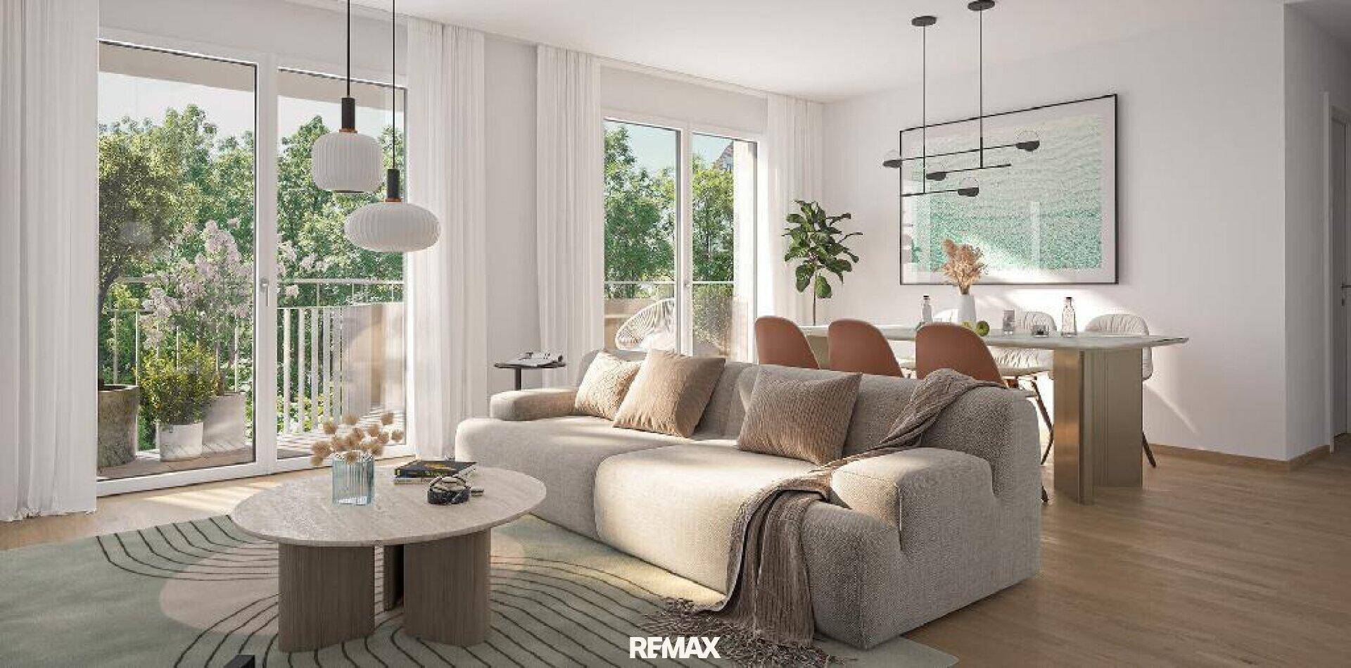 Heller Wohn- und Essbereich mit beigem Sofa, Holzboden und Blick ins Grüne.