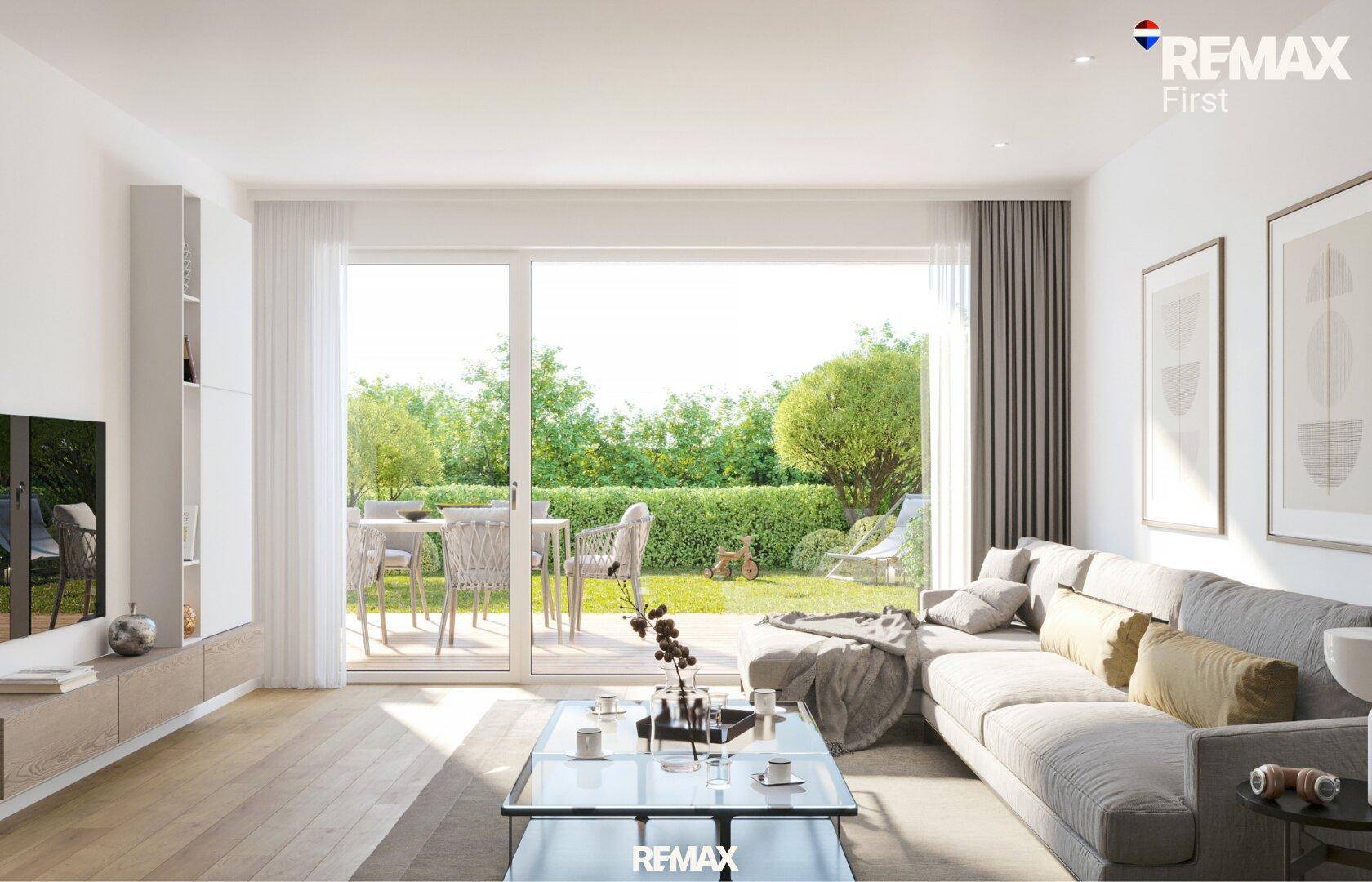 Gemütliches Wohnzimmer mit Zugang zum Garten und Blick ins Grüne.