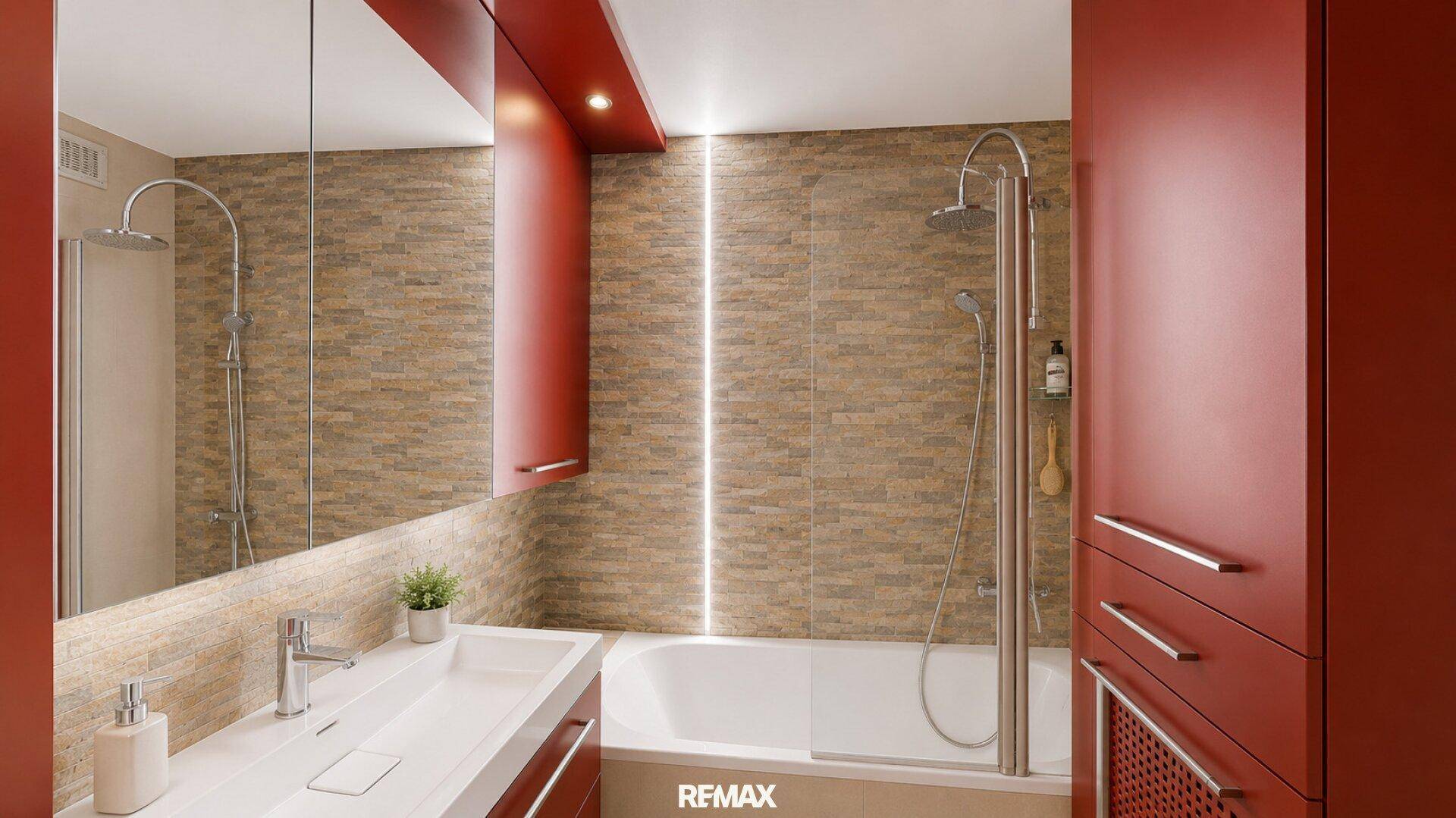 Modernes Badezimmer mit Badewanne, Dusche, Einzelwaschbecken und roten Schränken.