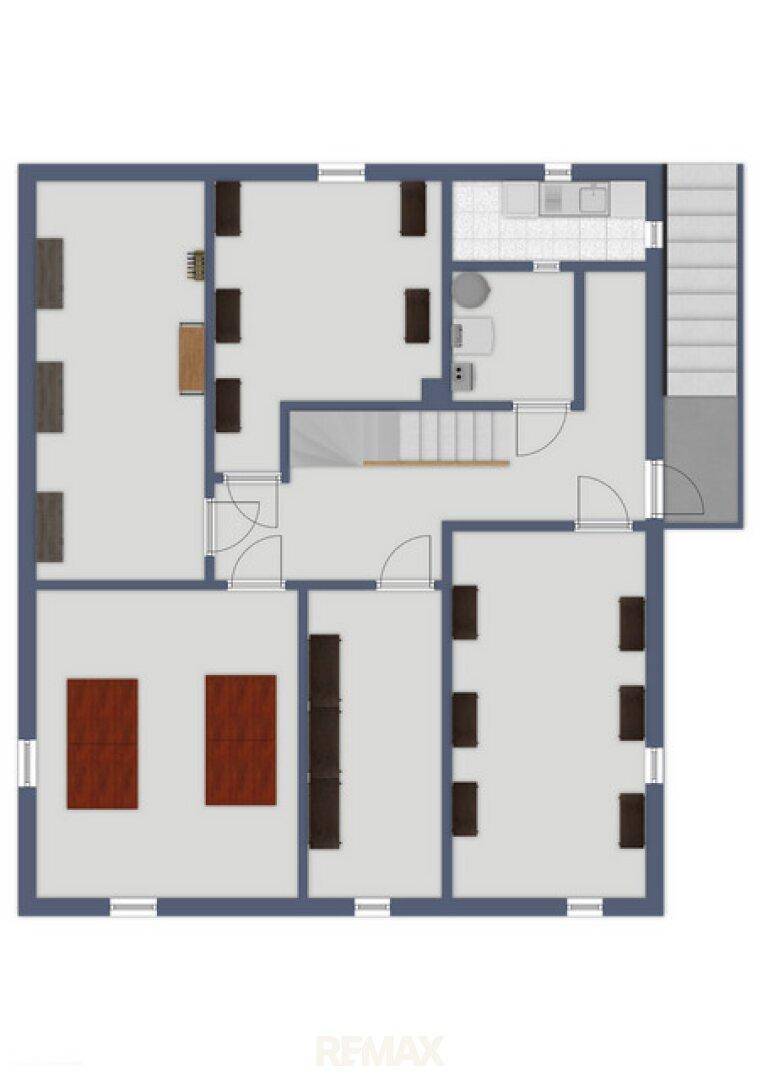 Grundrissplan eines Stockwerks mit mehreren Räumen, Treppen und einem Badezimmerbereich.