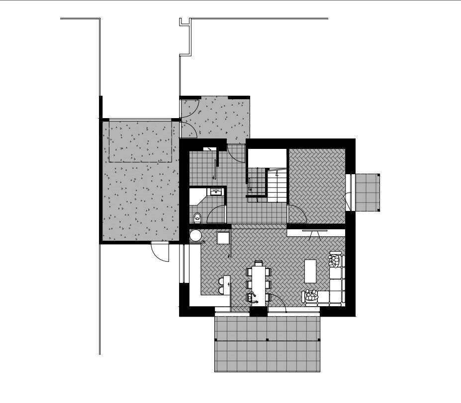 Grundriss des Erdgeschosses mit offenem Wohn-Essbereich, Küche und Terrasse.