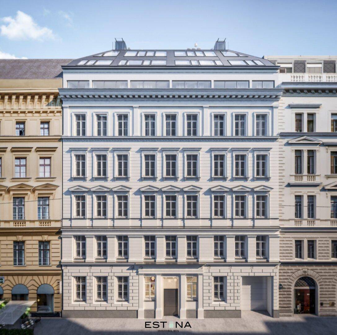 Elegante Fassade eines Altbaus mit vielen Fenstern und modernem Dachausbau.