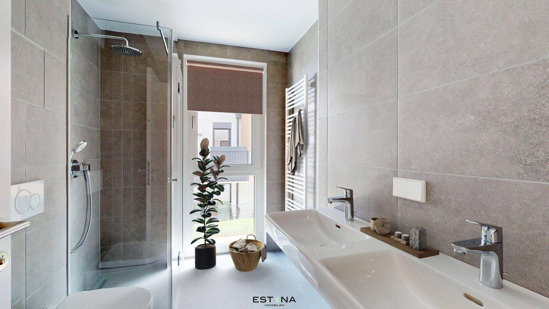 Modernes Badezimmer mit doppelten Waschbecken, großer Dusche und beheiztem Handtuchhalter.