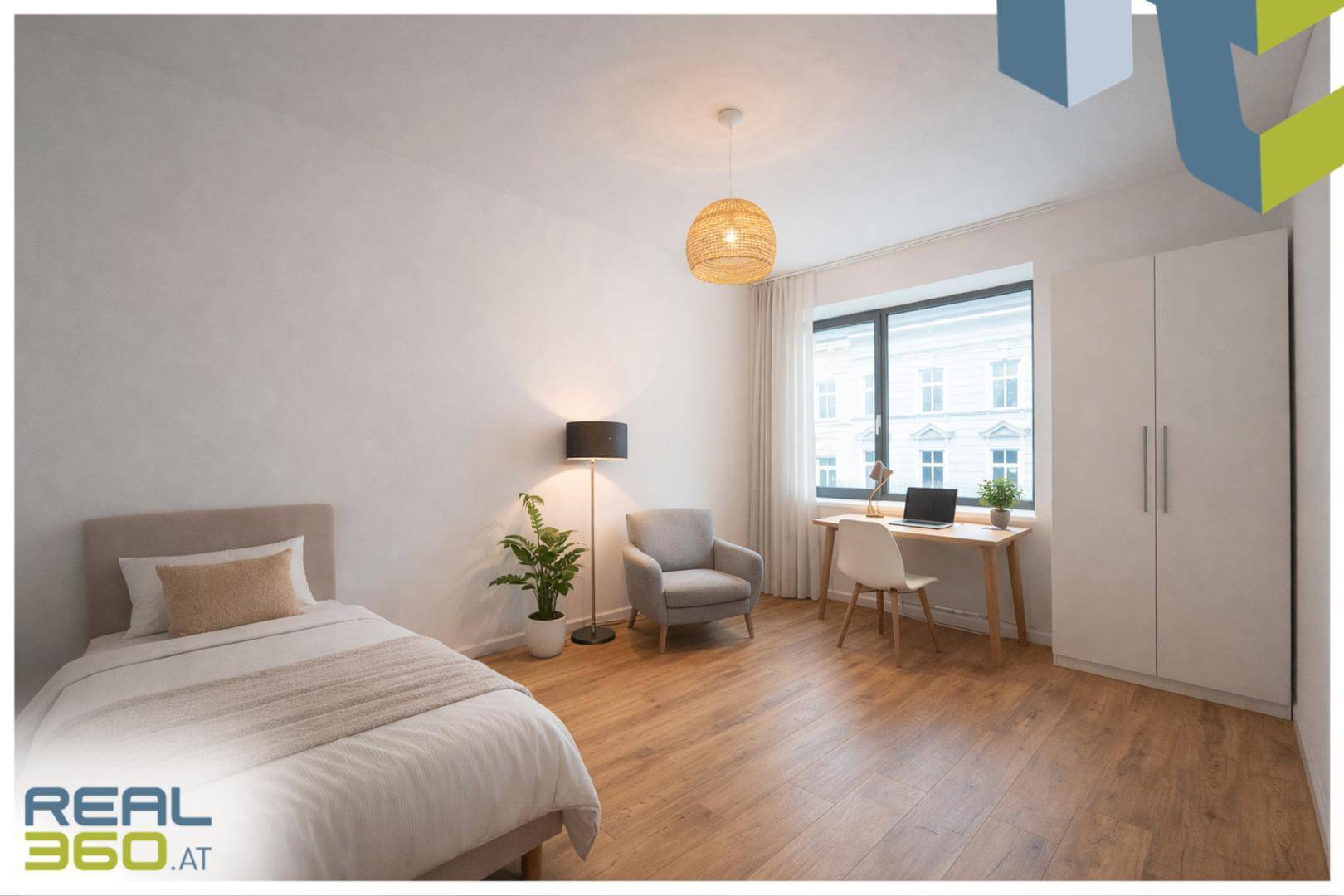 Modernes Schlafzimmer mit Einzelbett, Schreibtisch, Kleiderschrank und Holzfußboden.