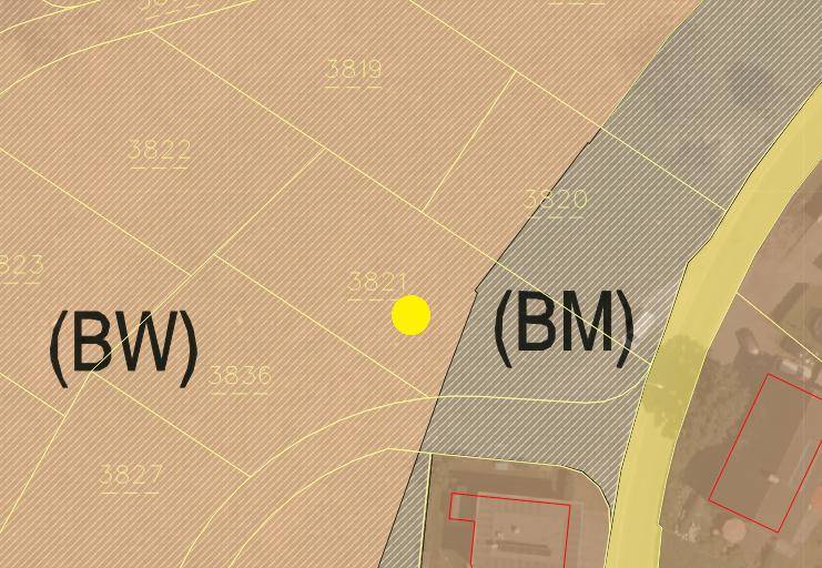 Ausschnitt aus einem Bebauungsplan, der verschiedene Nutzungszonen für Grundstücke darstellt.
