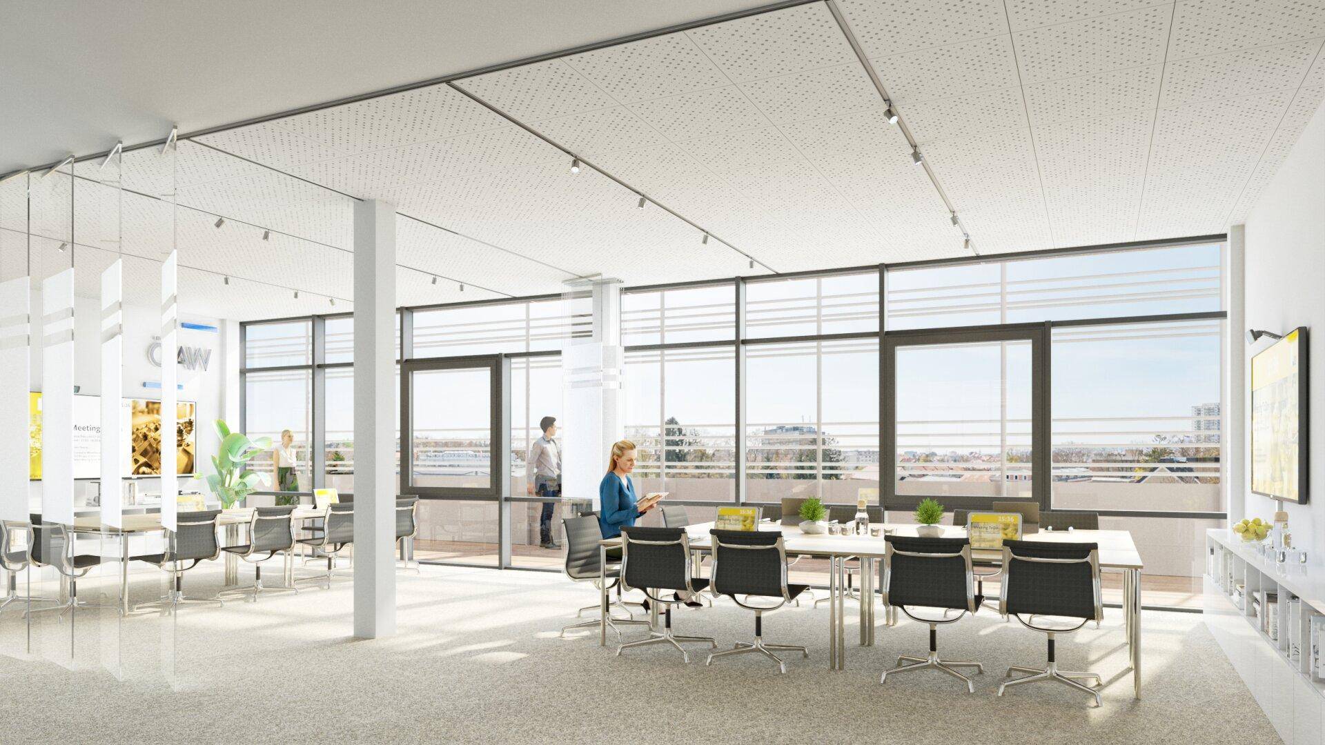 Geräumiger und heller Büroraum mit flexiblen Arbeitsbereichen und großen Fenstern mit Aussicht.