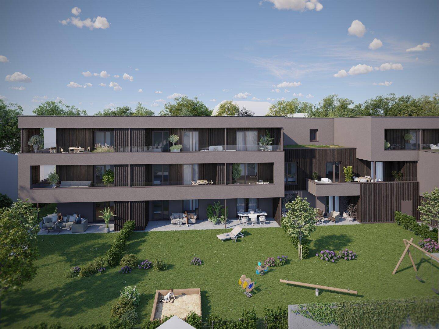 Ansicht der modernen Wohnanlage mit großzügigen Balkonen und einem grünen Gemeinschaftsgarten.