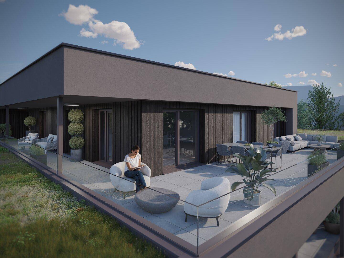 Großzügige Dachterrasse mit modernen Lounge-Möbeln und weitem Ausblick.