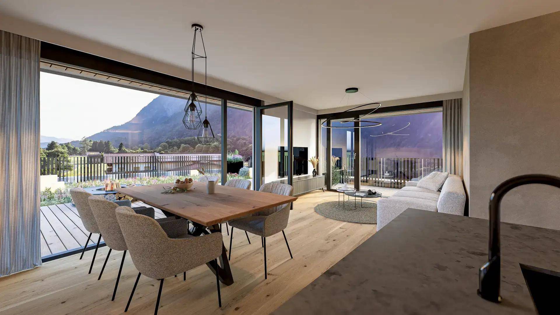 Heller Wohn-Essbereich mit Holzboden, großem Esstisch und Zugang zu einer Terrasse mit Bergblick.