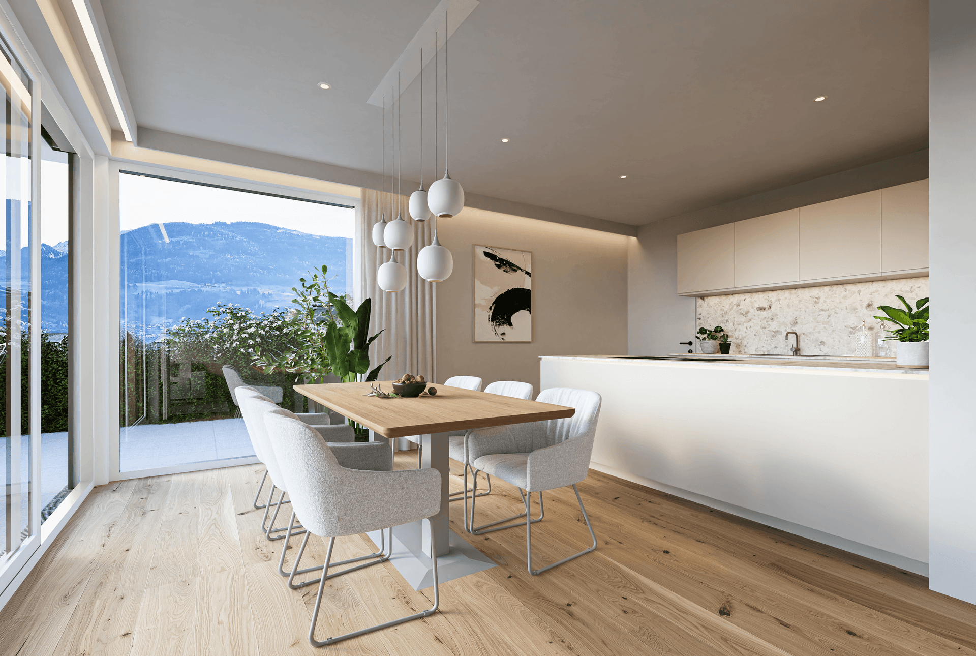 Moderne, offene Küche mit weißer Kücheninsel und Essbereich mit Bergblick.