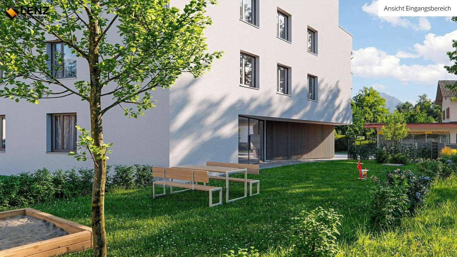 Gemeinschaftlicher Gartenbereich mit Picknicktisch, Sandkasten und viel Grünfläche.