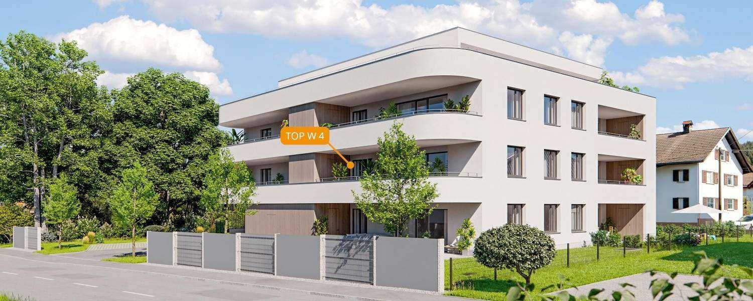 Ansicht der modernen Wohnanlage von der Seite mit Balkonen und umliegender Grünfläche.