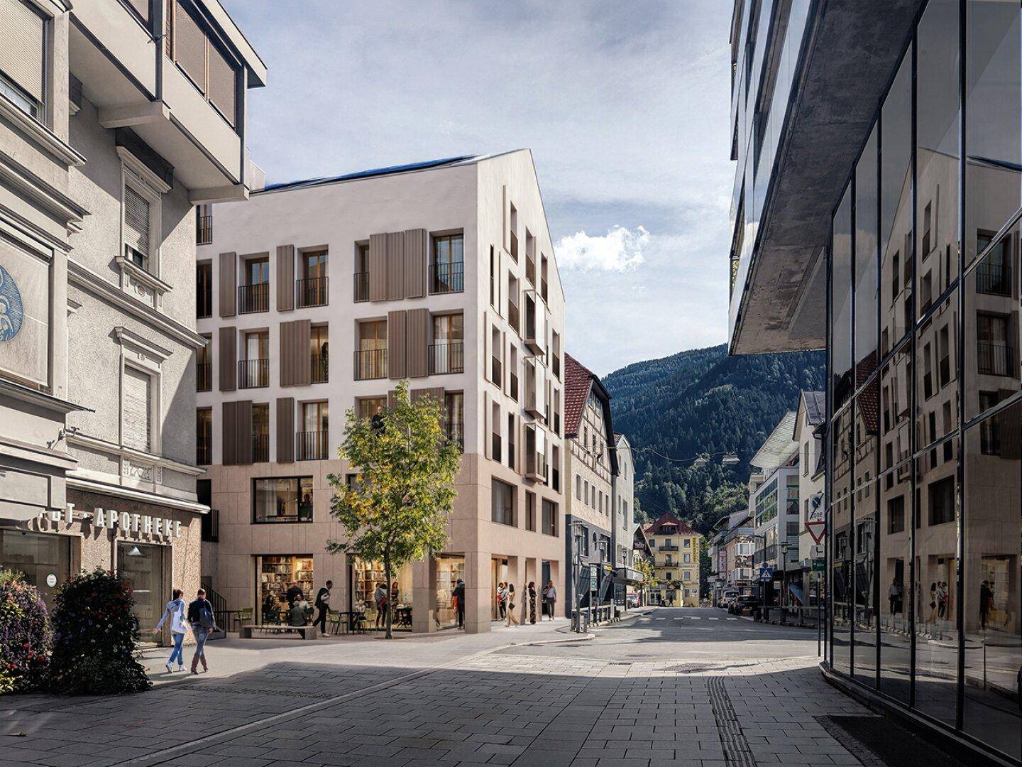 Ansicht der modernen Gebäudefassade mit Fensterläden und Geschäften im Erdgeschoss in einer Stadtstraße.
