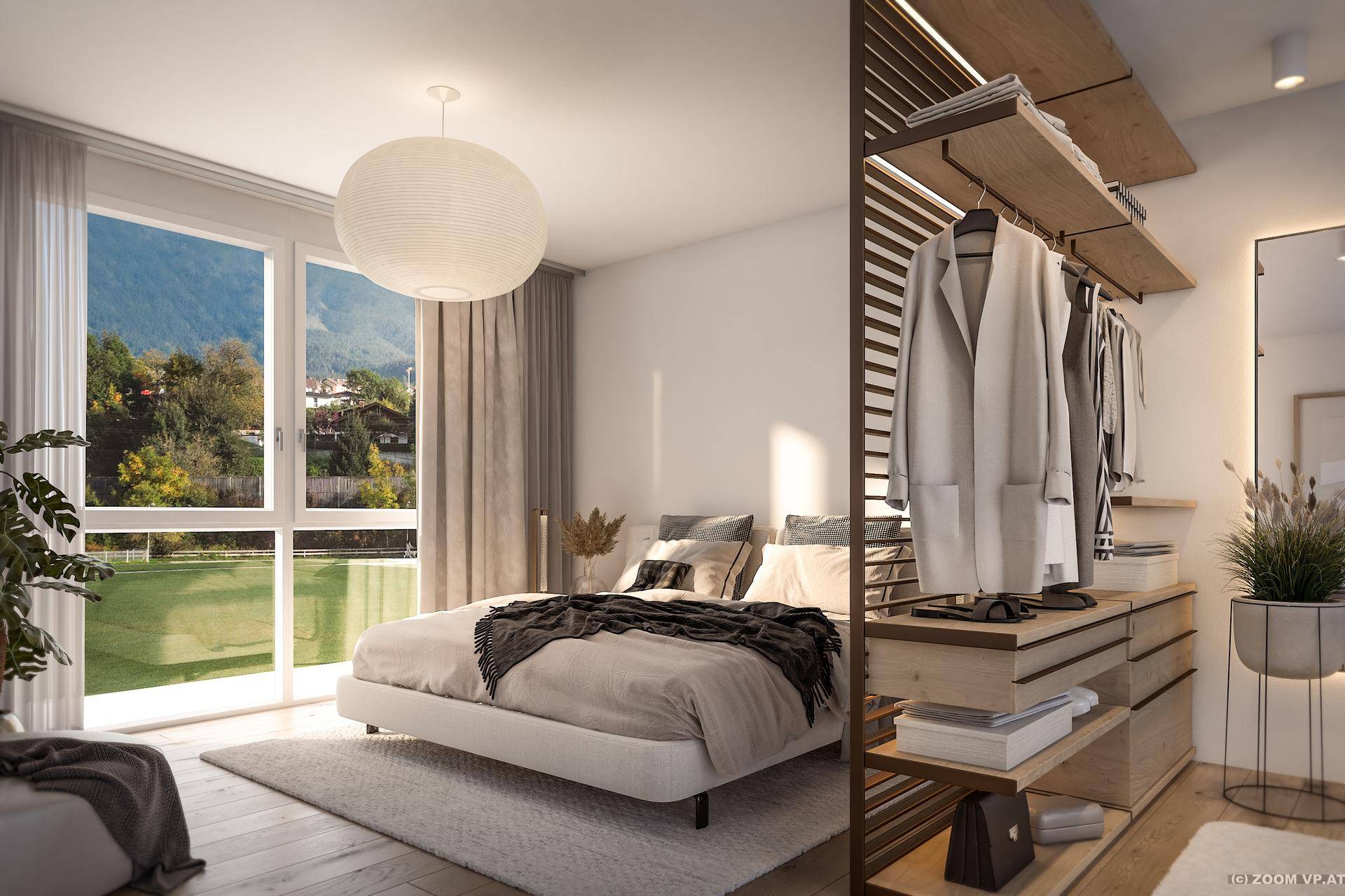 Helles Schlafzimmer mit großem Fenster, Bergblick und offenem Schranksystem.