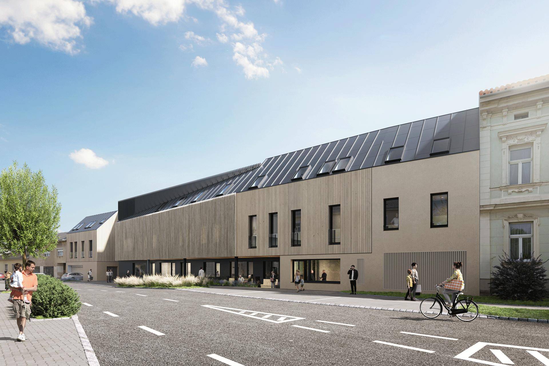 Lange Fassade eines modernen Gebäudes mit Holzverkleidung und Dachfenstern an einer Straße.