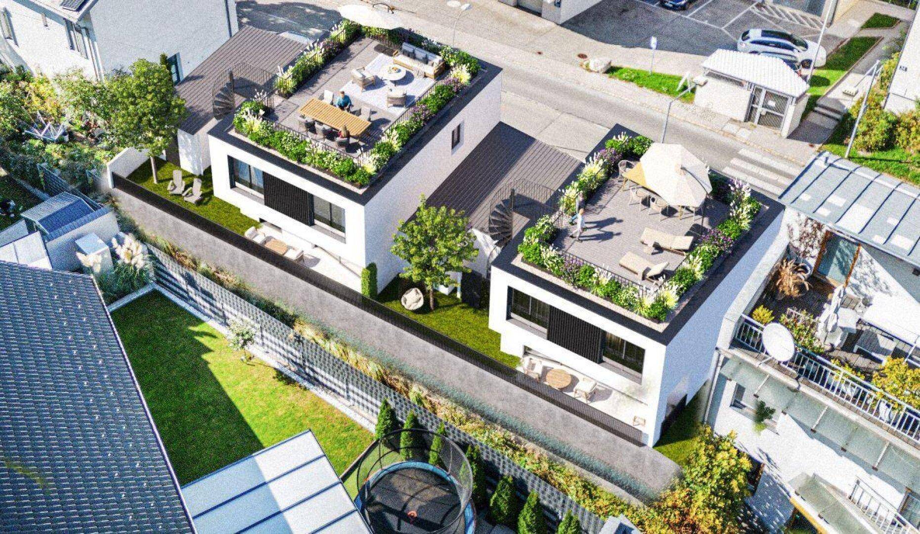 Schräge Luftaufnahme der modernen Häuser mit Dachterrassen und Gärten in der Nachbarschaft.