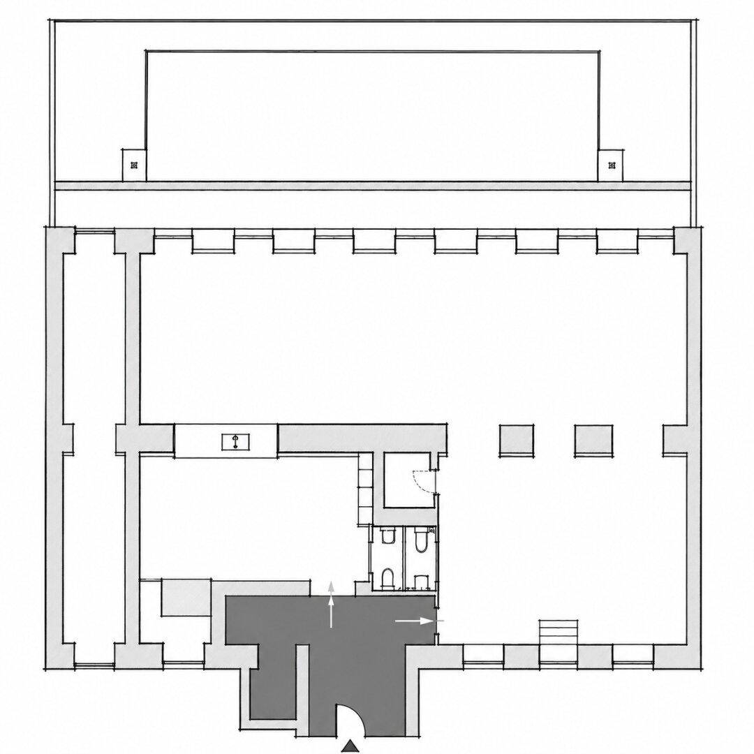 Grundrissplan einer Gewerbefläche mit mehreren Räumen, Küche und Sanitäranlagen.