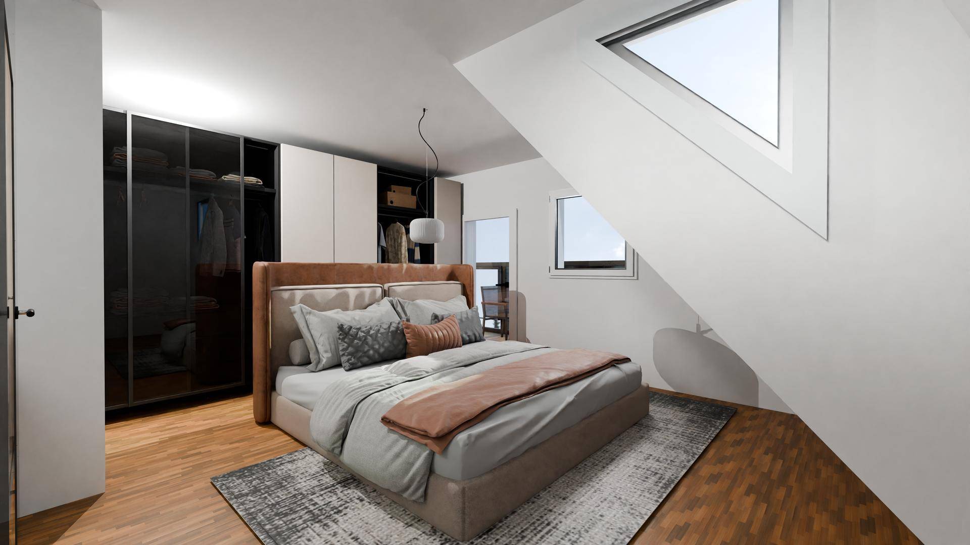Geräumiges Schlafzimmer im Dachgeschoss mit großem Bett und Kleiderschrank.