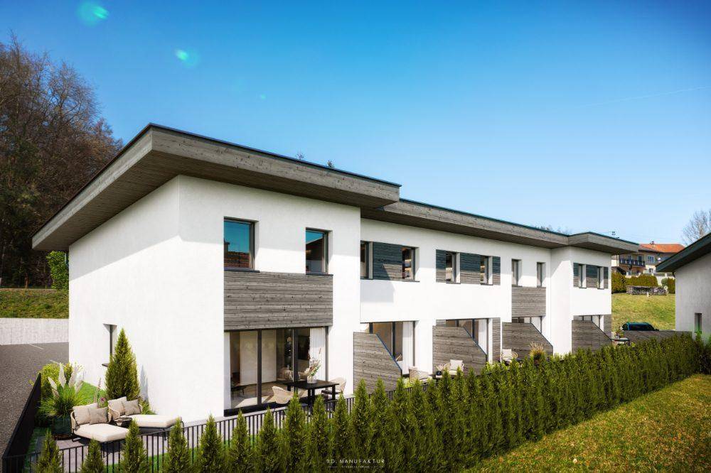 Moderne Reihenhäuser mit weißer Fassade, Holzverkleidung und privaten Terrassenbereichen.