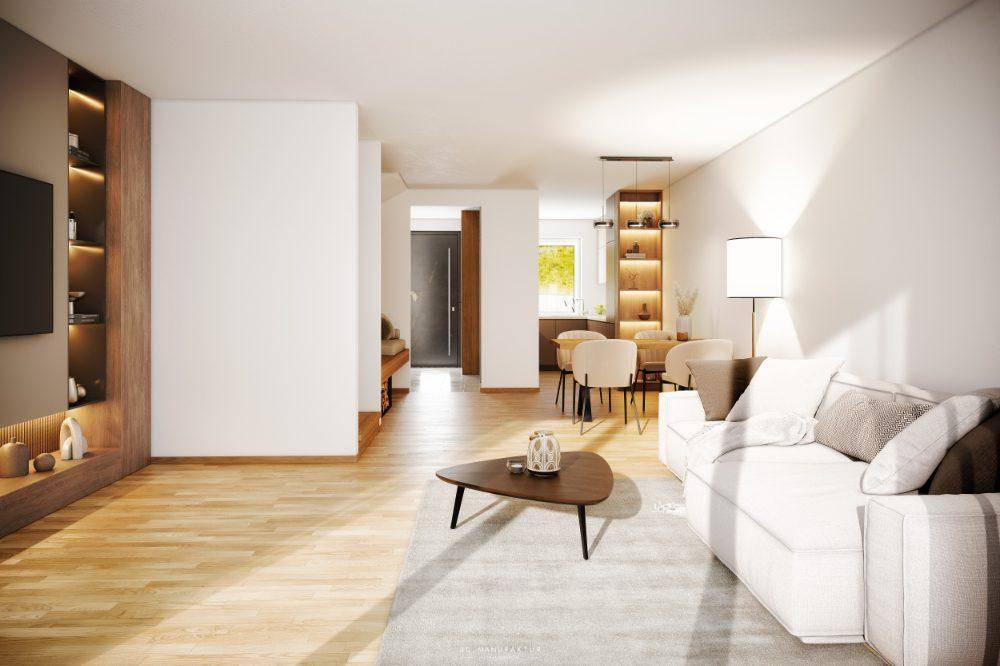 Helles Wohnzimmer mit bequemer Couch, Holzboden und offener Verbindung zum Essbereich.