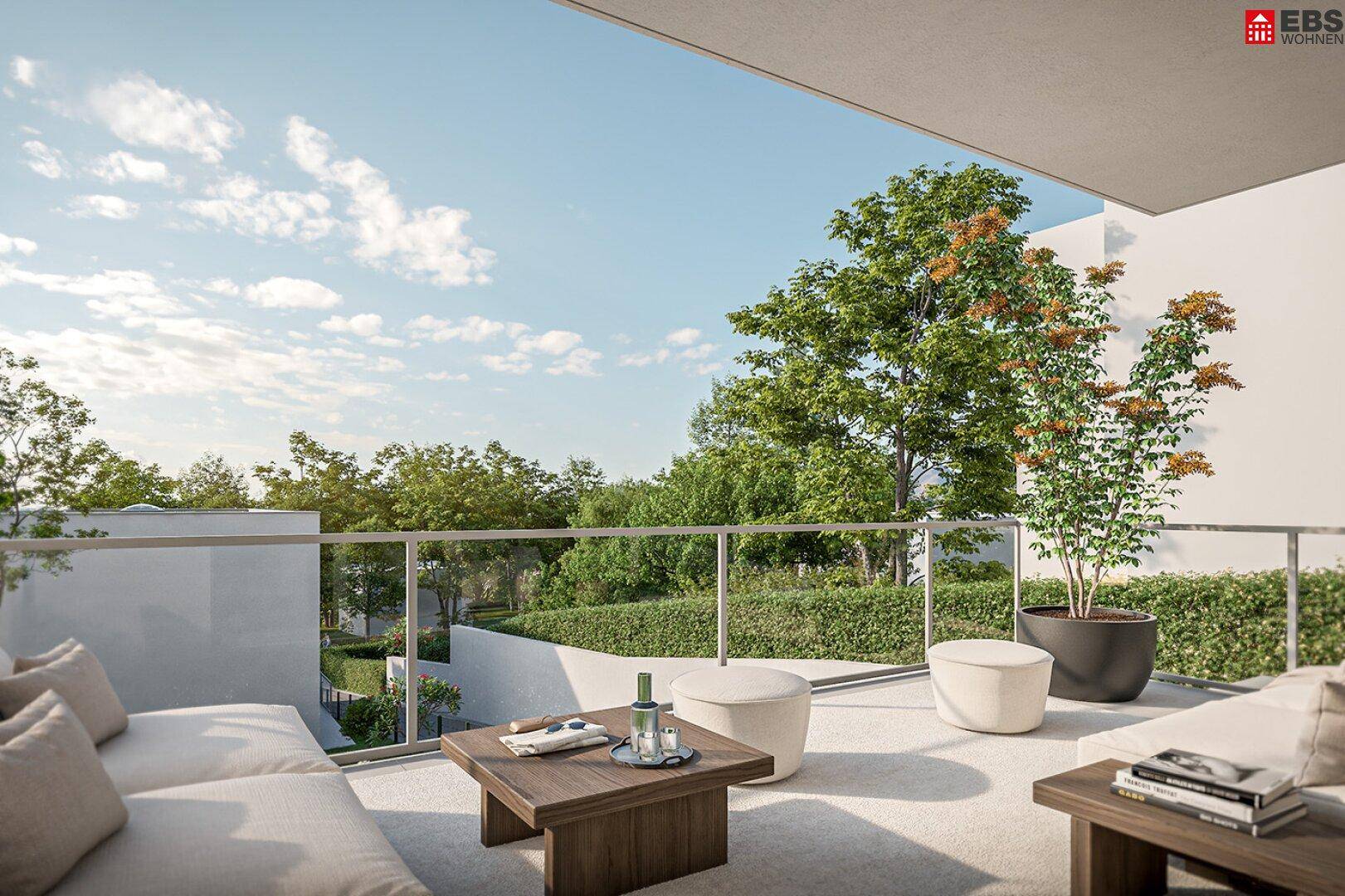 Geräumiger Balkon mit modernen Loungemöbeln und Blick ins Grüne.