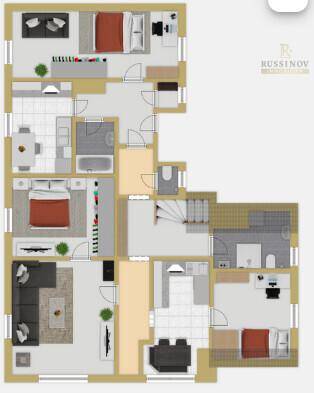 Detaillierter Grundriss einer Etage mit mehreren Schlafzimmern, Bädern und Wohnbereichen.