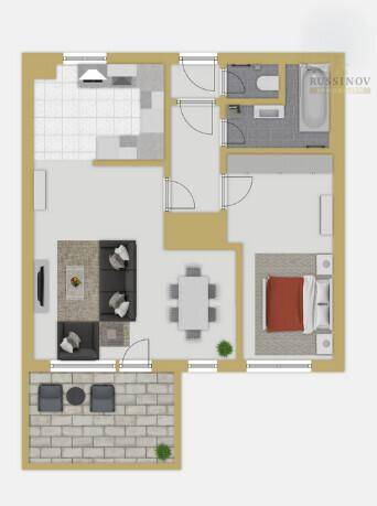 Grundriss einer Wohnung mit offenem Wohn-Essbereich, separater Küche, Schlafzimmer und großem Balkon.