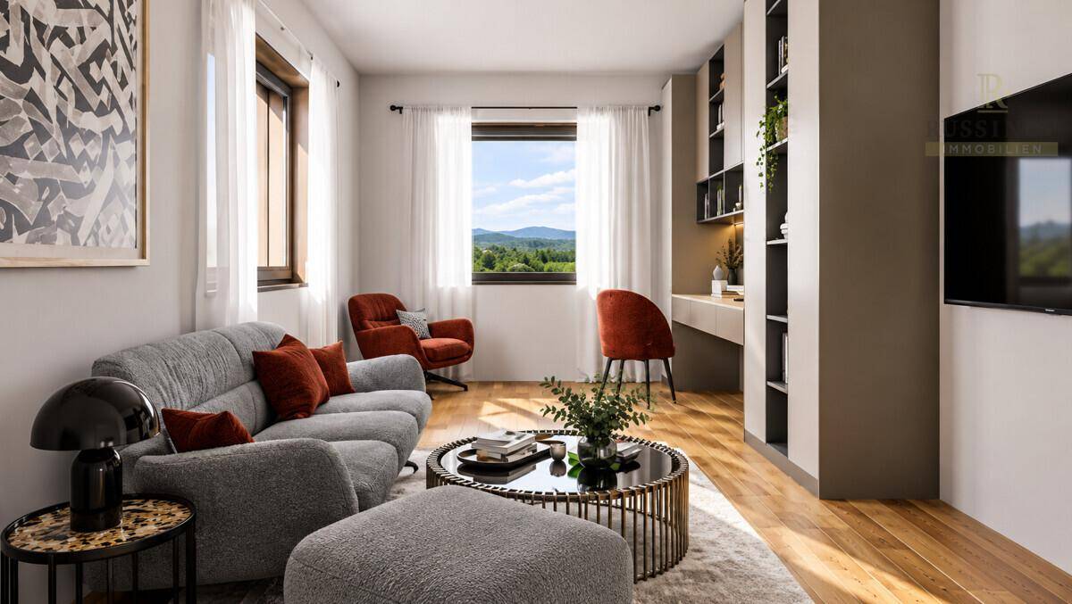 Gemütliches Wohnzimmer mit bequemer Couch, Holzboden und Blick auf die grüne Landschaft.