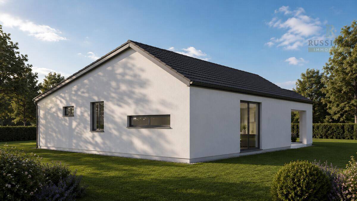 Seitenansicht eines modernen Einfamilienhauses mit schlichtem Design und großen Fensterflächen.