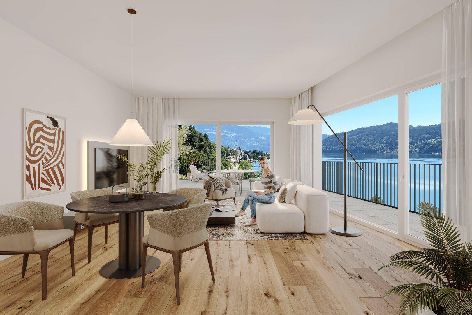 Helles Wohn- und Esszimmer mit Holzboden, großen Fenstern und Seeblick, ideal für entspannte Stunden.